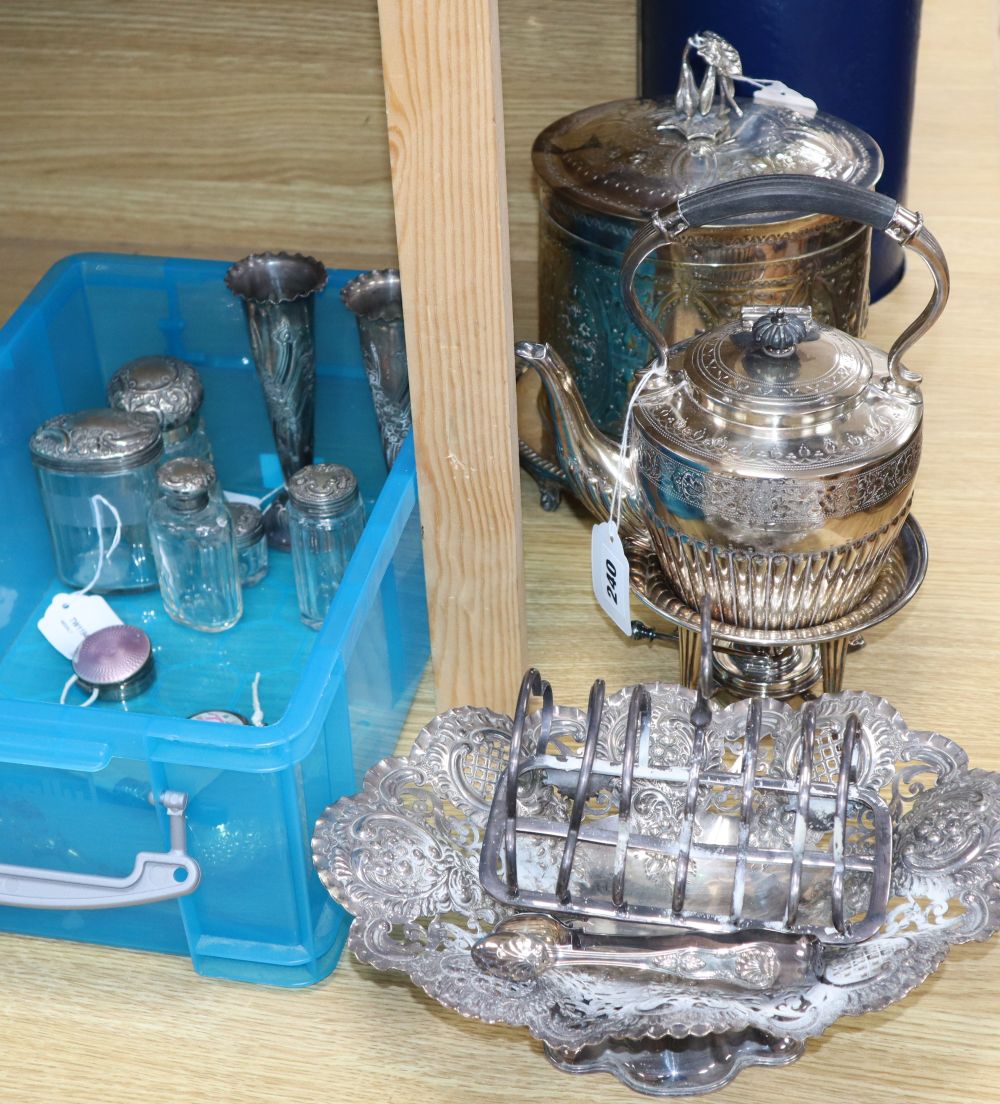 A pair of embossed silver specimen vases, five silver-mounted toilet bottles, two silver and enamel boxes and a quantity of plated item